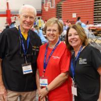 (Left to right) Terry Dickinson, Missions of Mercy founder, Barbara Rollins, director of logistics for Mission of Mercy, and Michelle McGregor, RDH; Director of Community and Collaborative Partnerships, VCU, attend the Piedmont Smiles MoM event in October 2023. .