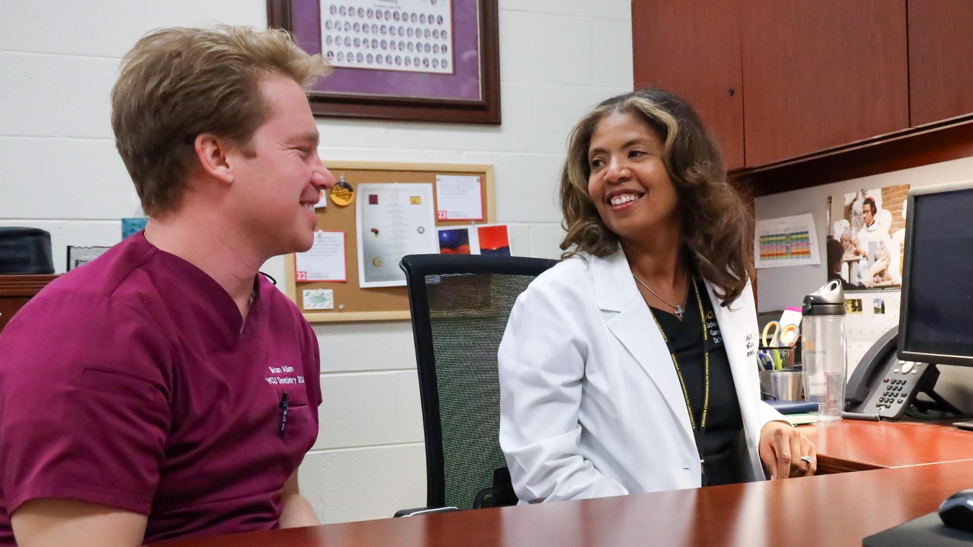 Dr. VaCora Rainey and fourth year dental student Brian Allen.