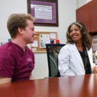 Dr. VaCora Rainey and fourth year dental student Brian Allen.