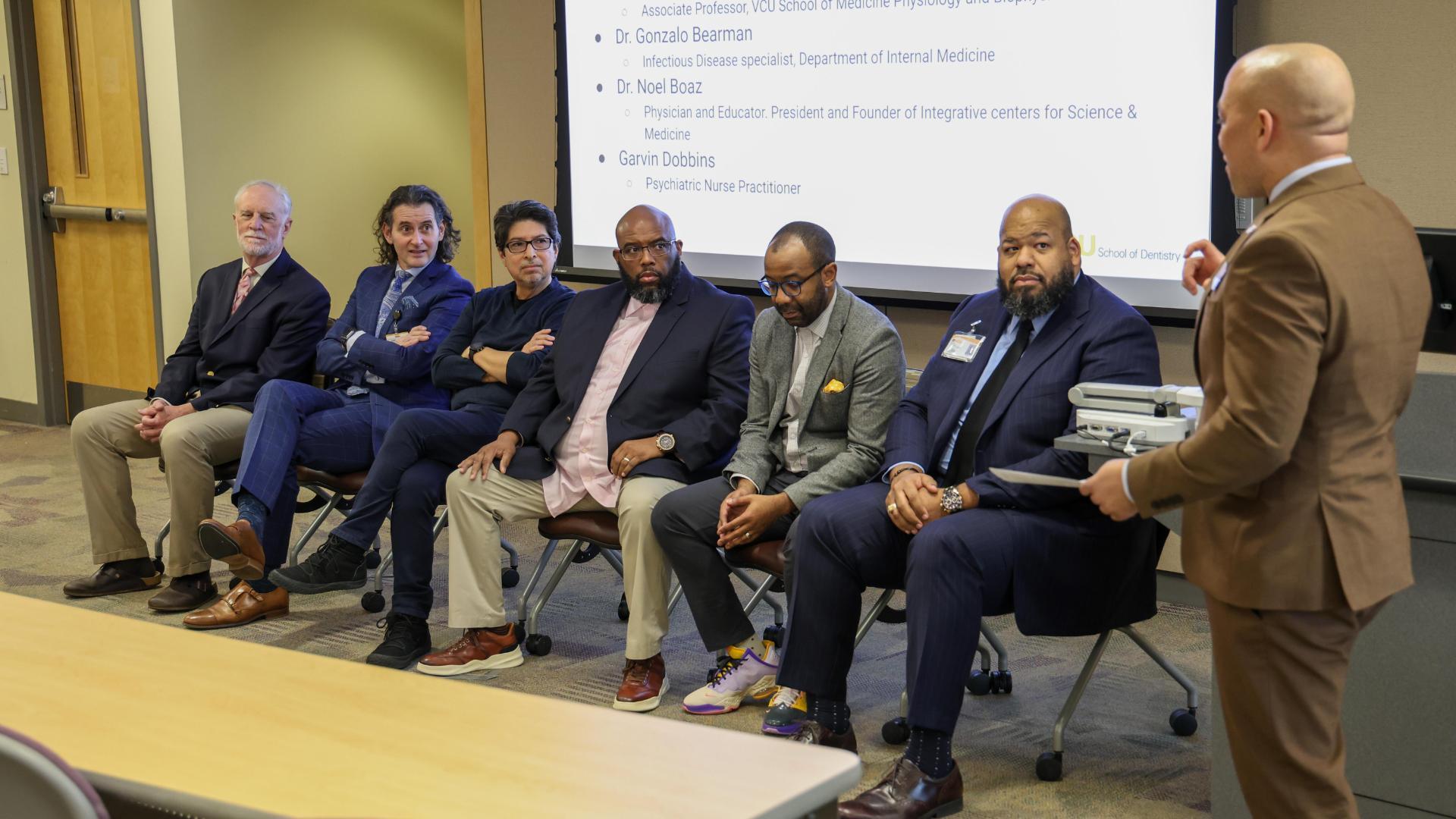 A second panel of graduate and professional faculty include: (left to right) Noel Boaz, Ph.D., M.D., Gonzalo Bearman, M.D., Carlos Escalante, Ph.D., Garvin Dobbins, M.S.N., RN, PMHNP, Carlos Smith, D.D.S., M.Div, Eric B. Freeman, M.D. The panel was moderated by Stephan Davis, DNP, M.H.S.A., FACHE. 