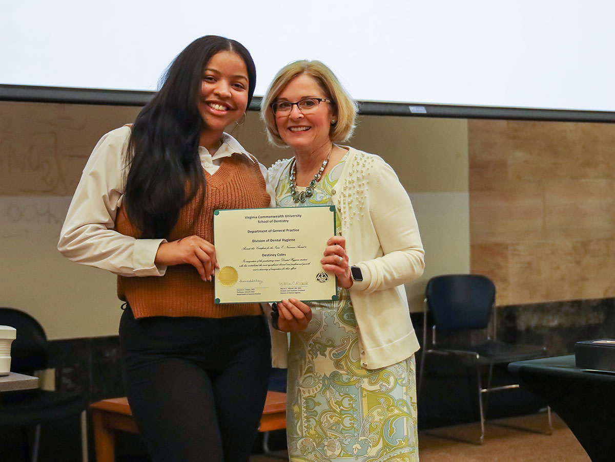 Coles accepts the Irene E. Newman Award at the Senior Awards Ceremony.