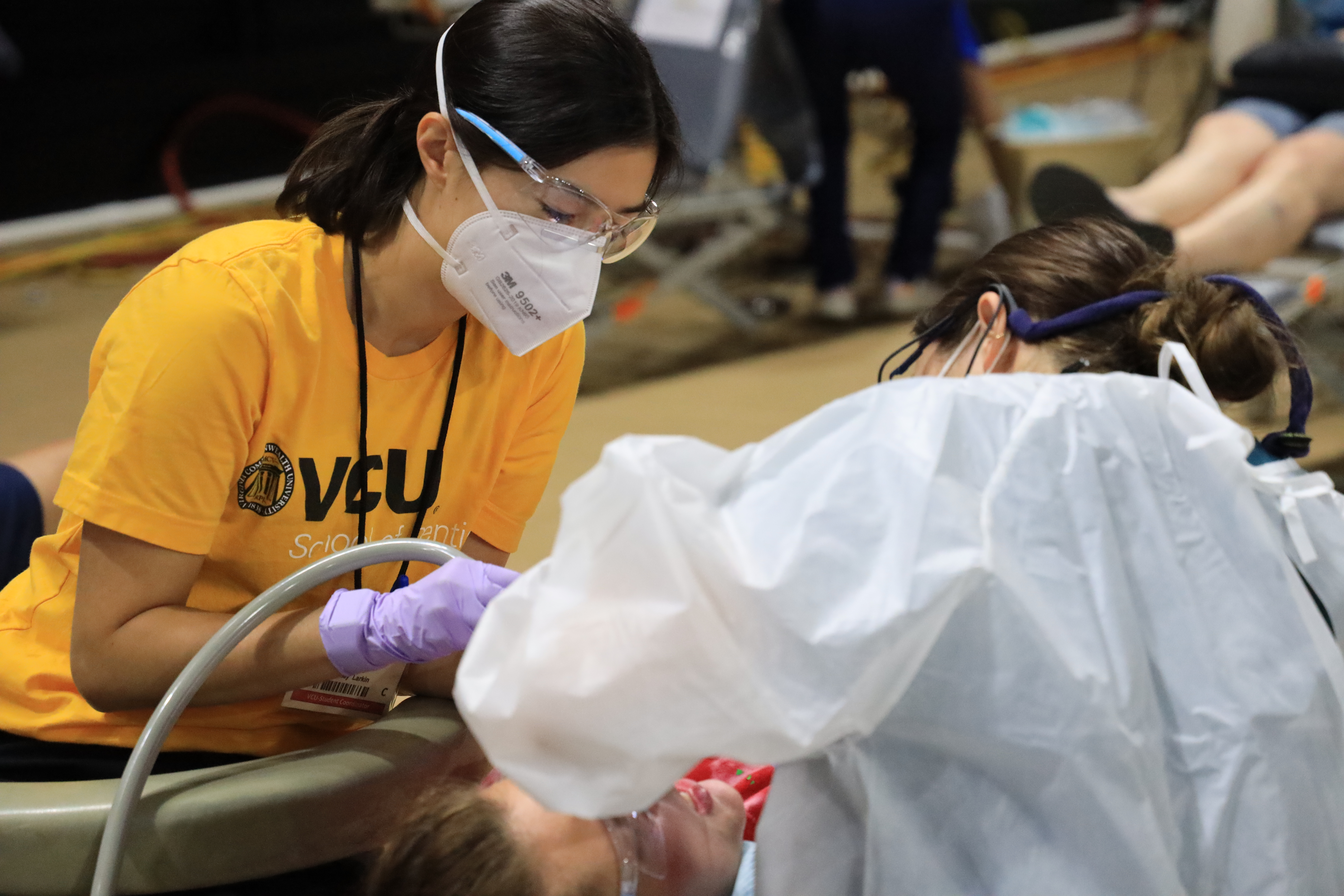 Bailey Larkin (right) assists with procedure during MoM project.