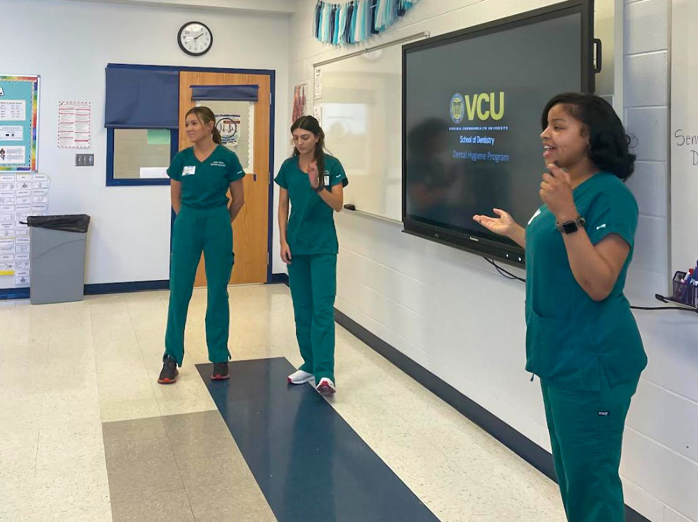 Coles and her dental hygiene classmates provide educational instruction to students at a local high school.