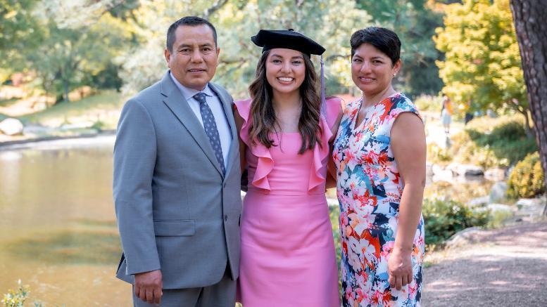 Dr. Laura Choque and her parents.