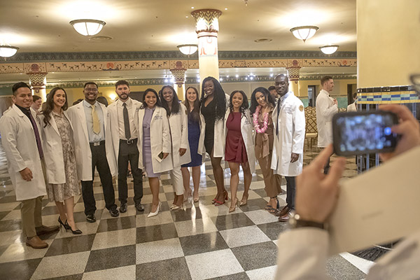 A group of students pause for a picture following the ceremony.